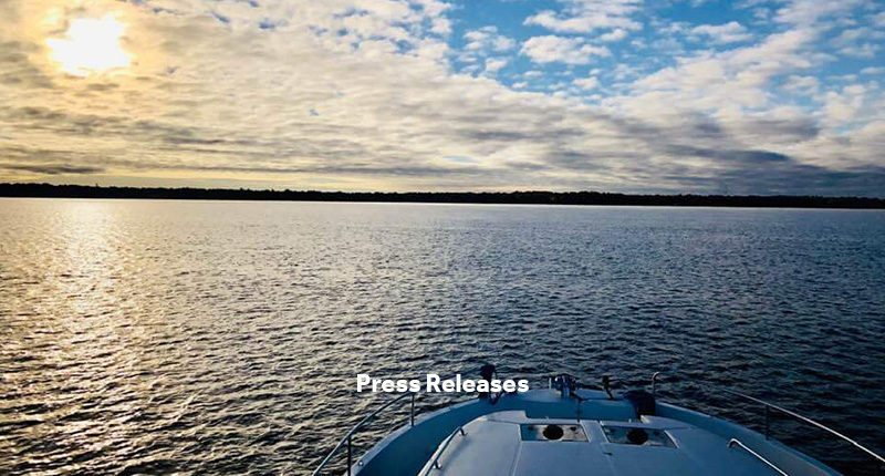 Press Releases Bloc with image of water view from a boat in the background