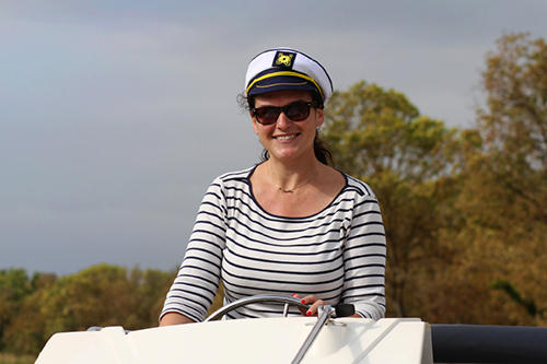 Woman Boat Captain on a Le Boat houseboat cruiser rental