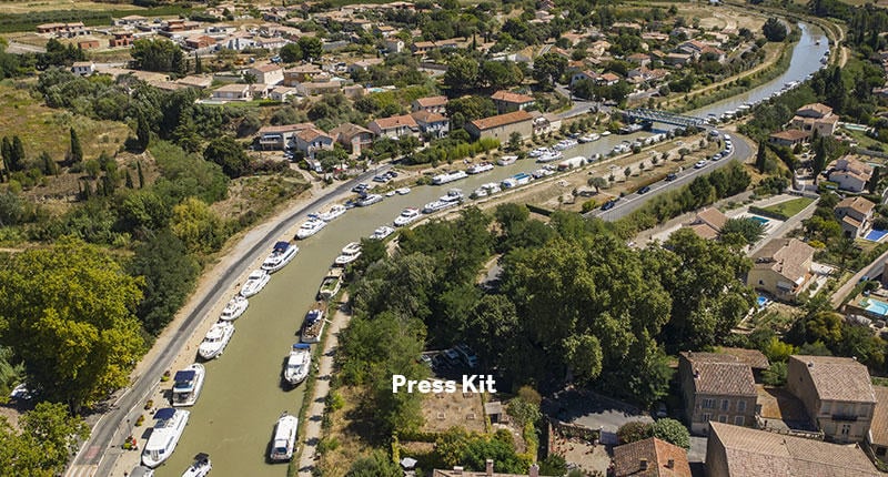 Press Kit Bloc with image of the Canal du Midi in the background