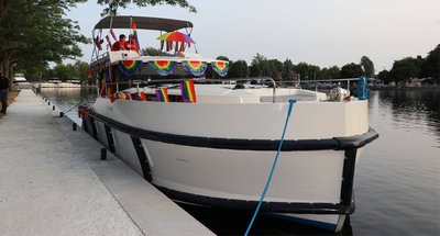 Le Boat Horizon houseboat decorated for Pride in Smiths Falls on the Rideau Canal