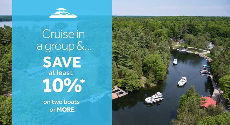 Group boat discount save at least 10% when you book two boats or more offer with three boats on river in Canada in the background